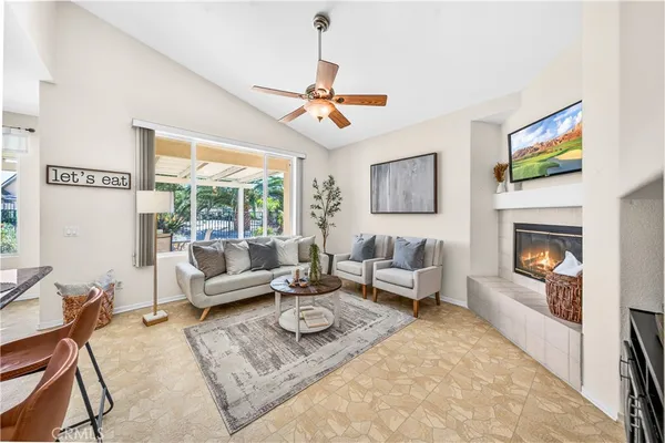 a living room with furniture and a fireplace