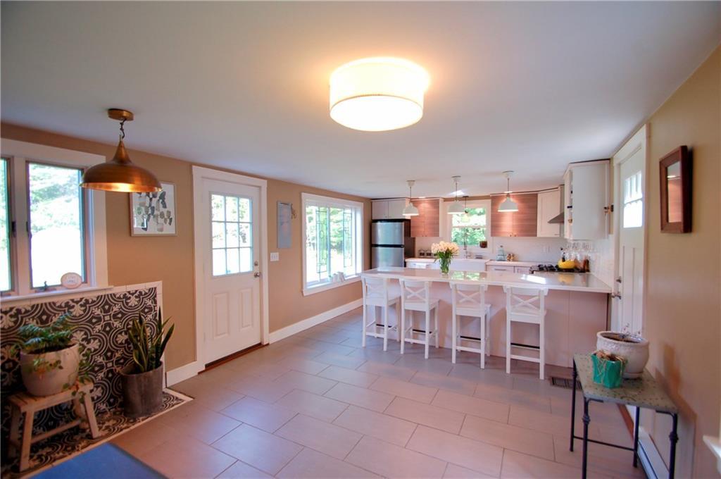 464 Durham Road Brunswick, ME 04011 - Photo 10 of 35 Breakfast Nook w/Woodstove