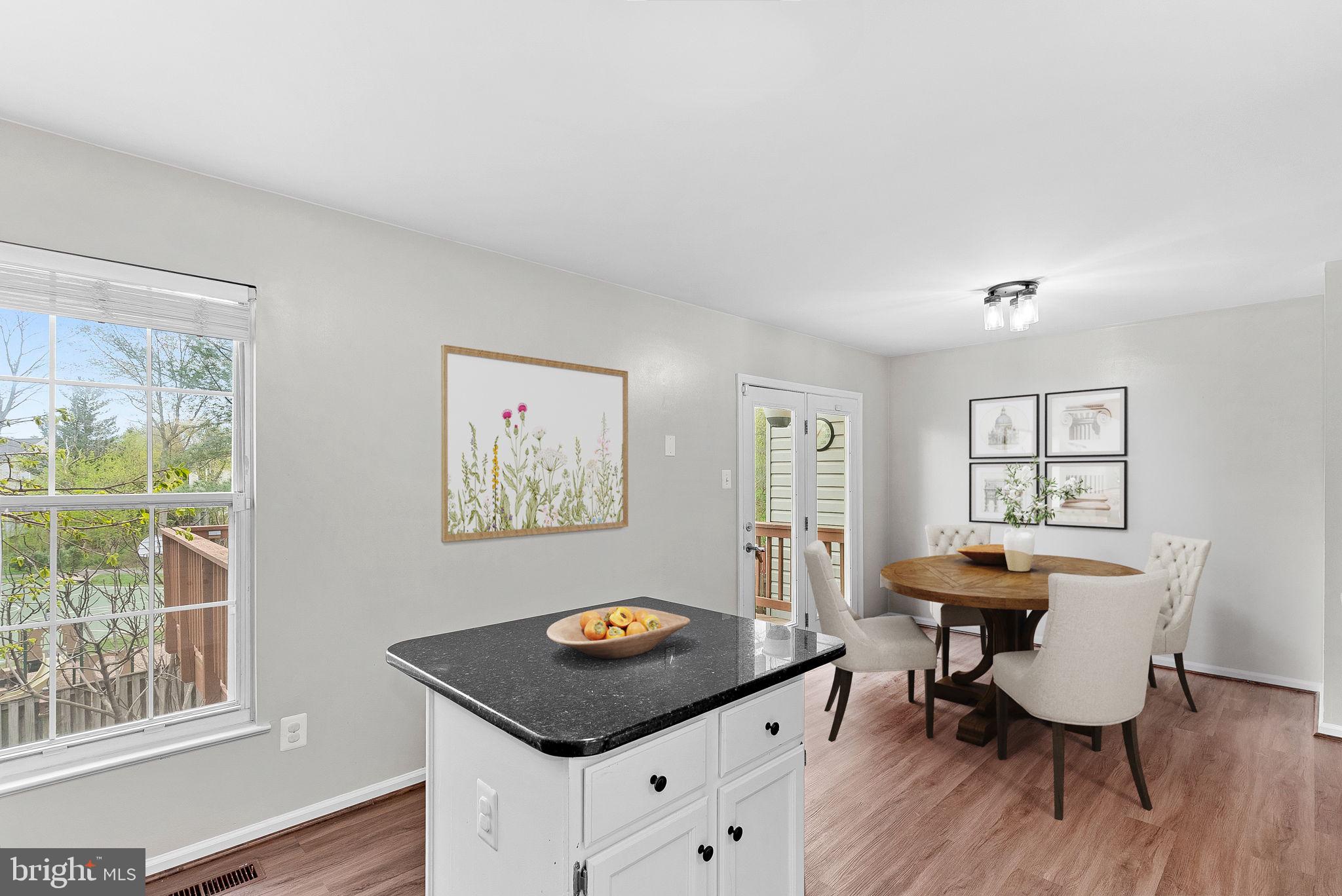 21074 Cornerpost Square Ashburn, VA 20147 - Photo 13 of 81 a view of a workspace with furniture and a window