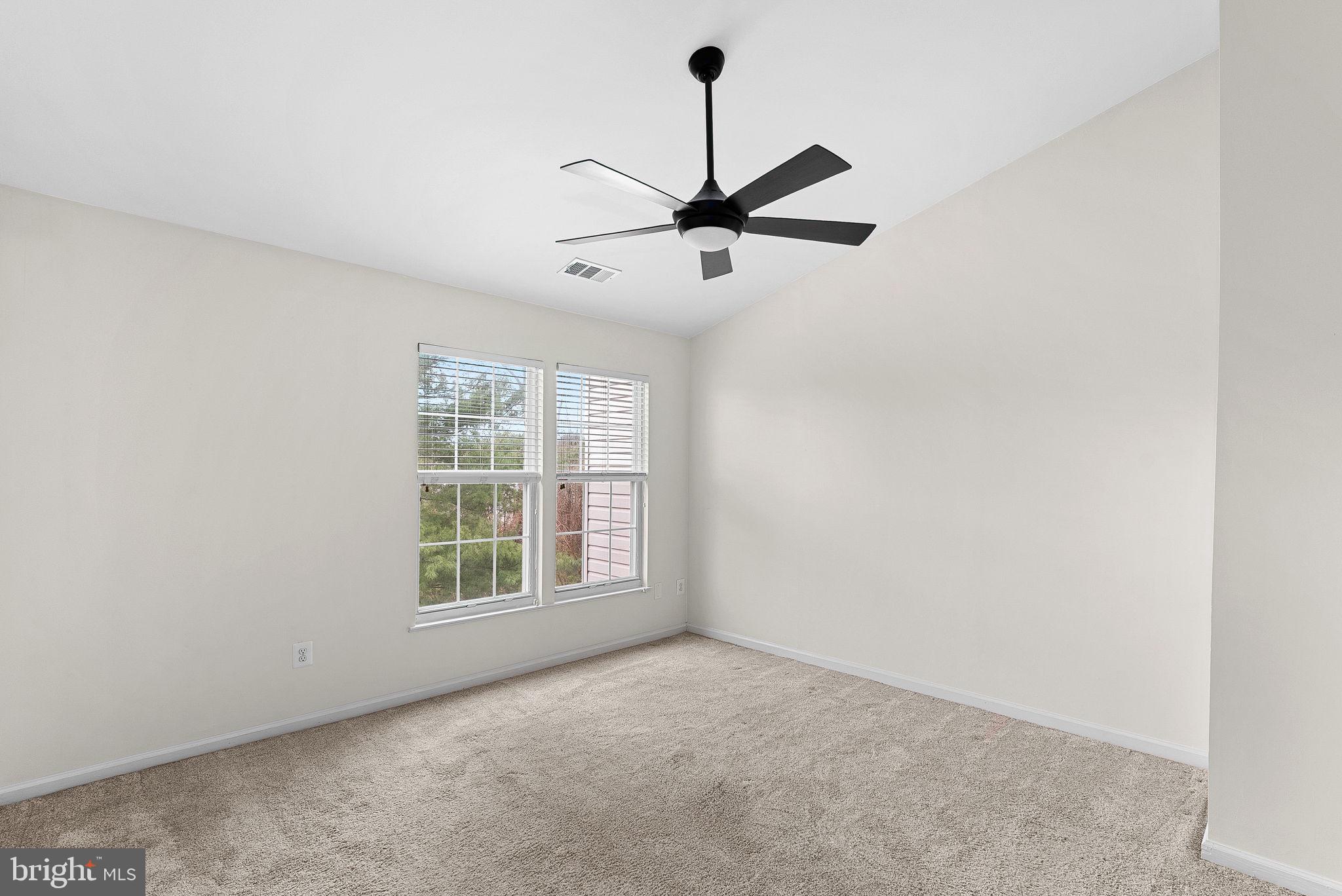 21074 Cornerpost Square Ashburn, VA 20147 - Photo 24 of 81 a view of an empty room with a window