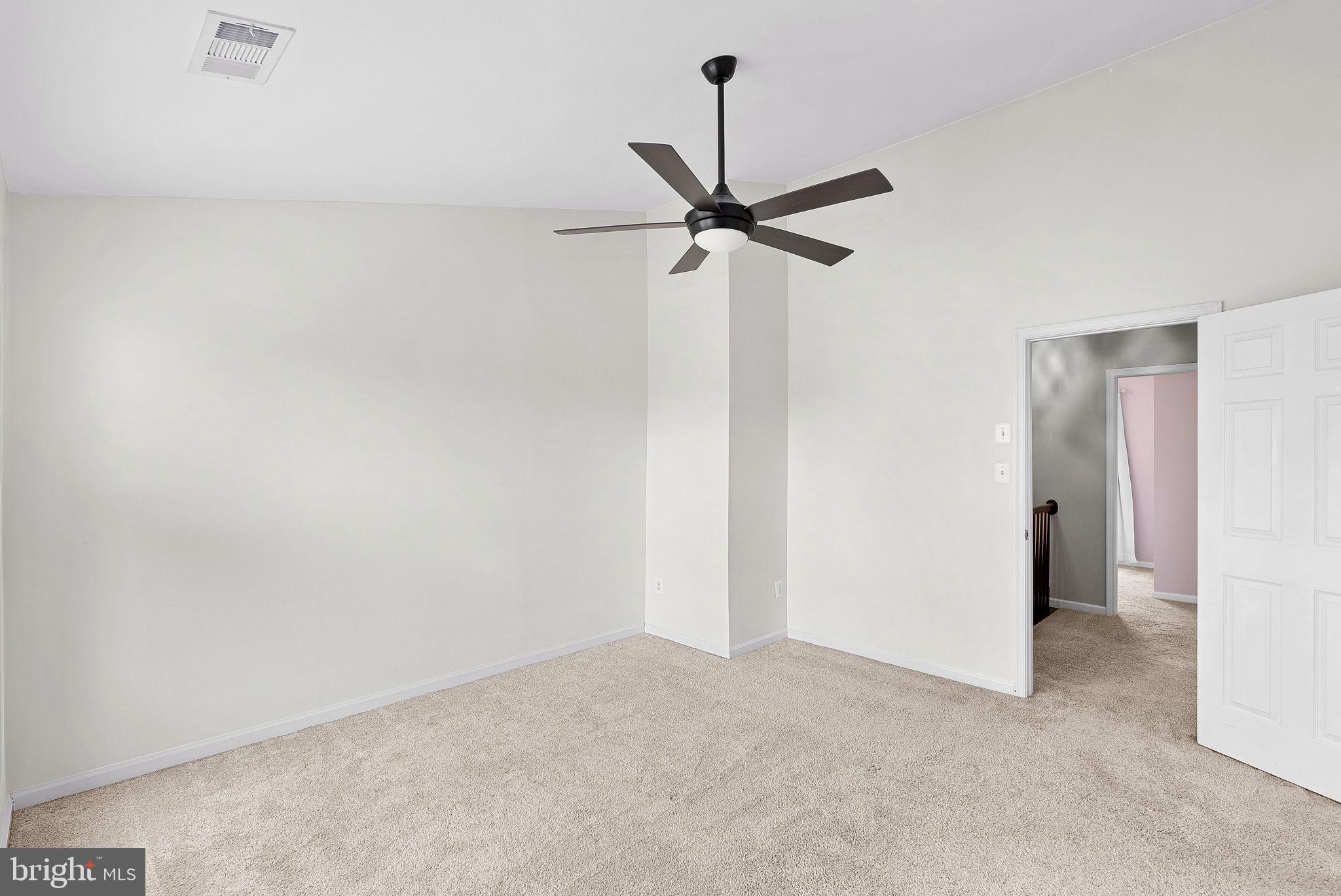 21074 Cornerpost Square Ashburn, VA 20147 - Photo 25 of 81 a view of a room with a ceiling fan