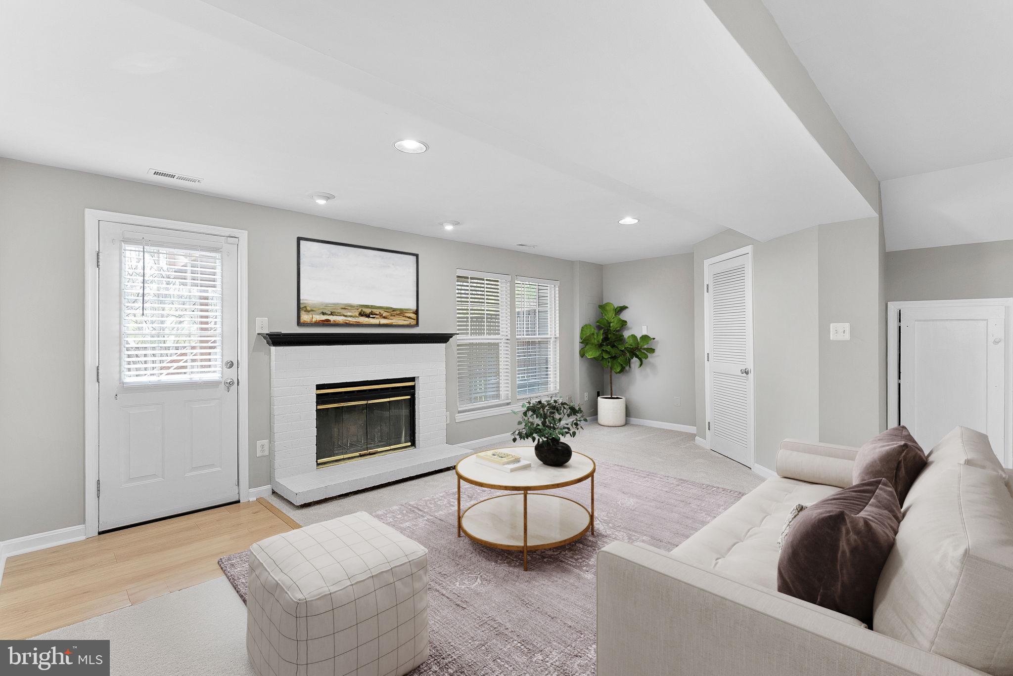 21074 Cornerpost Square Ashburn, VA 20147 - Photo 37 of 81 a living room with furniture a window and a fireplace