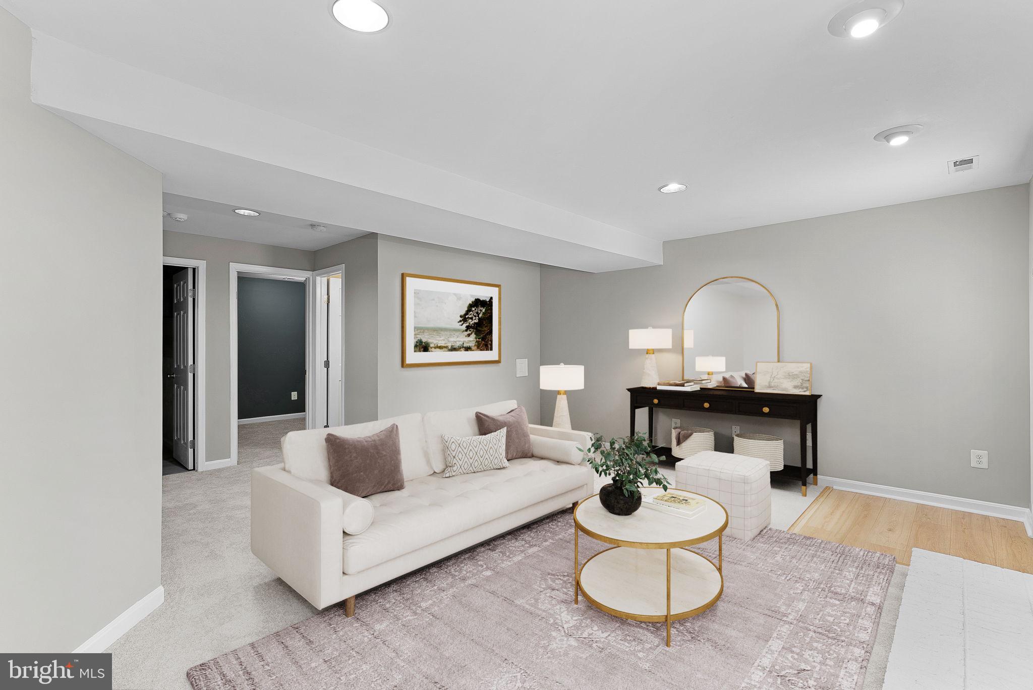 21074 Cornerpost Square Ashburn, VA 20147 - Photo 39 of 81 a living room with furniture and a mirror