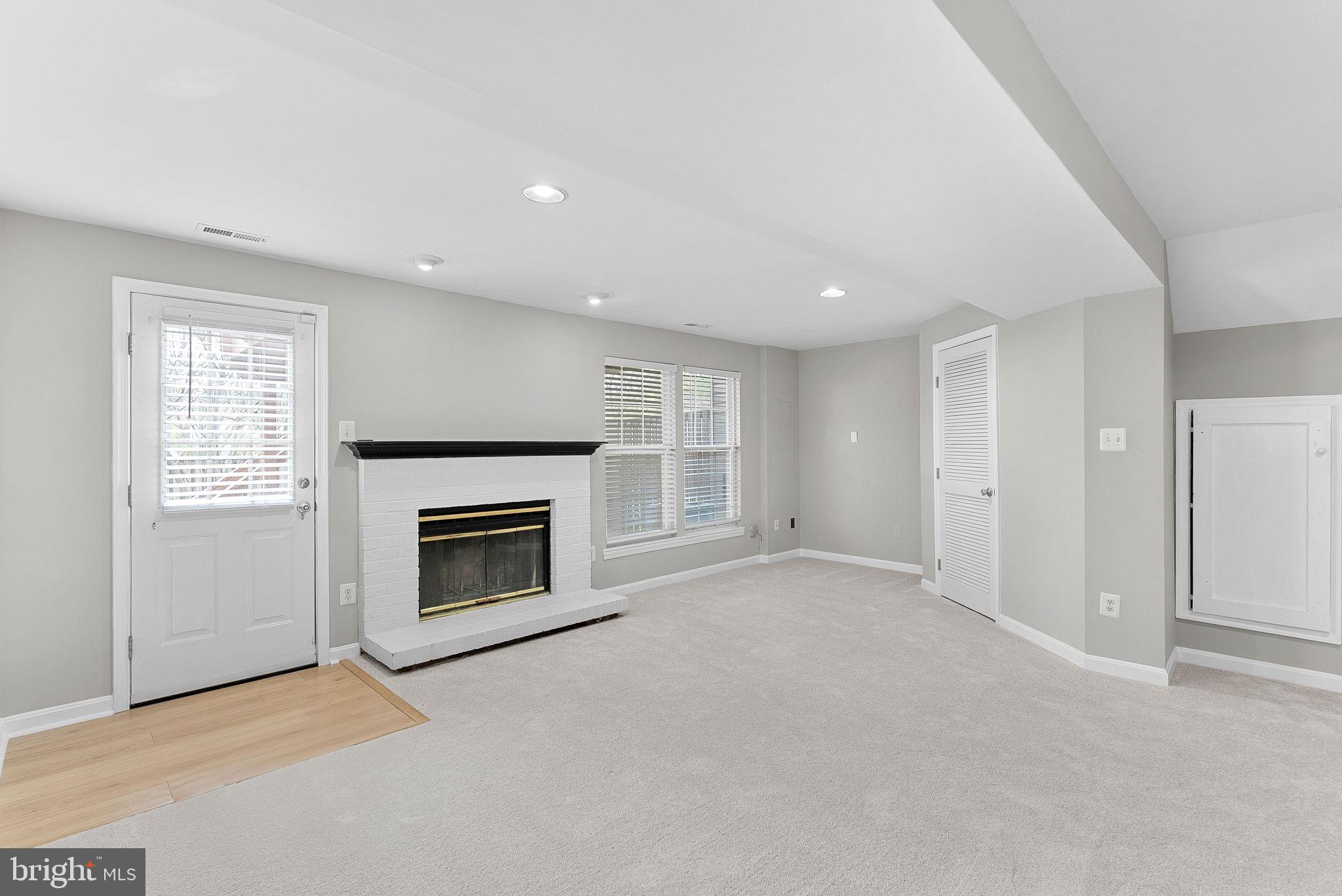 21074 Cornerpost Square Ashburn, VA 20147 - Photo 42 of 81 an empty room with fireplace and windows