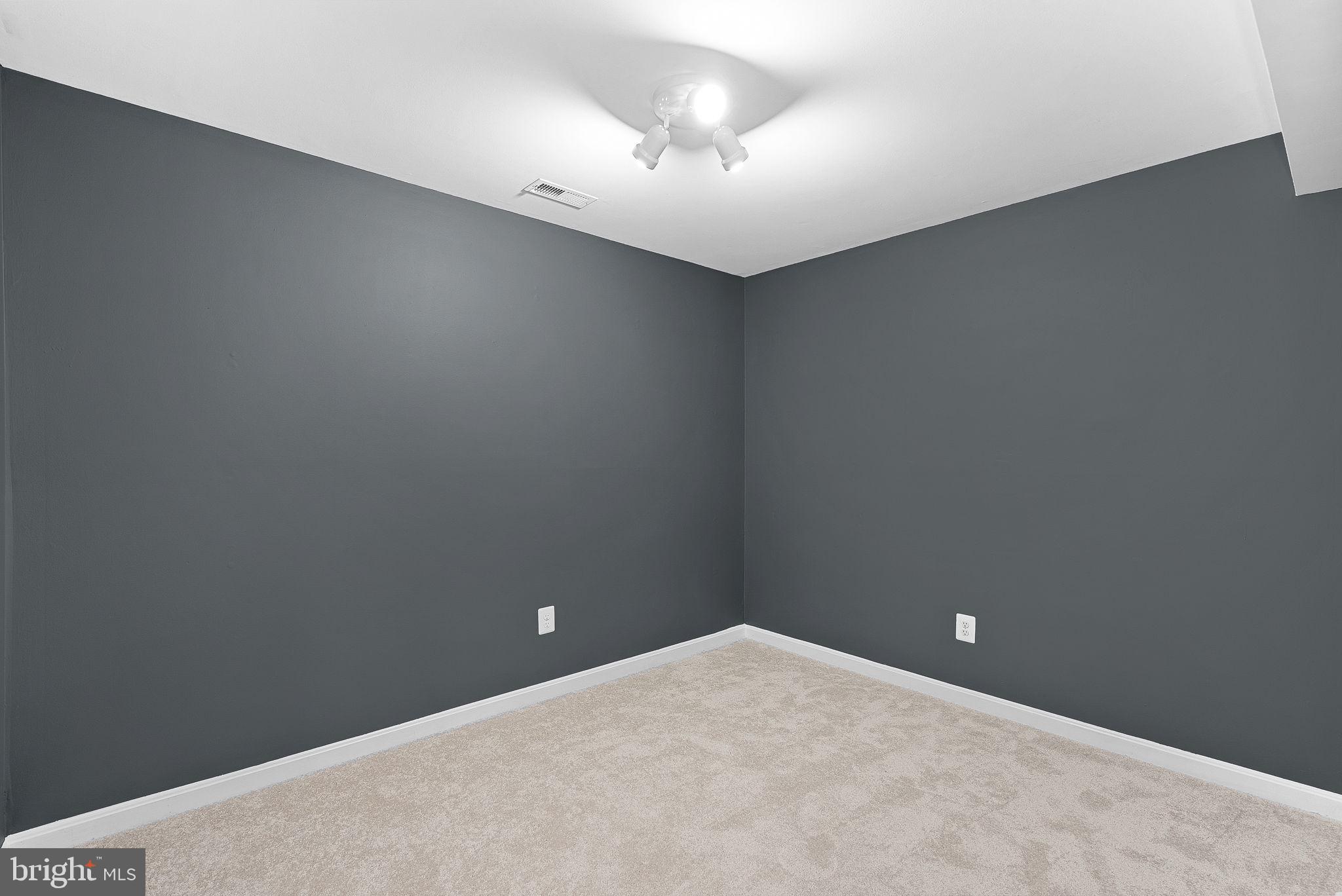 21074 Cornerpost Square Ashburn, VA 20147 - Photo 46 of 81 an empty room with a chandelier fan and window