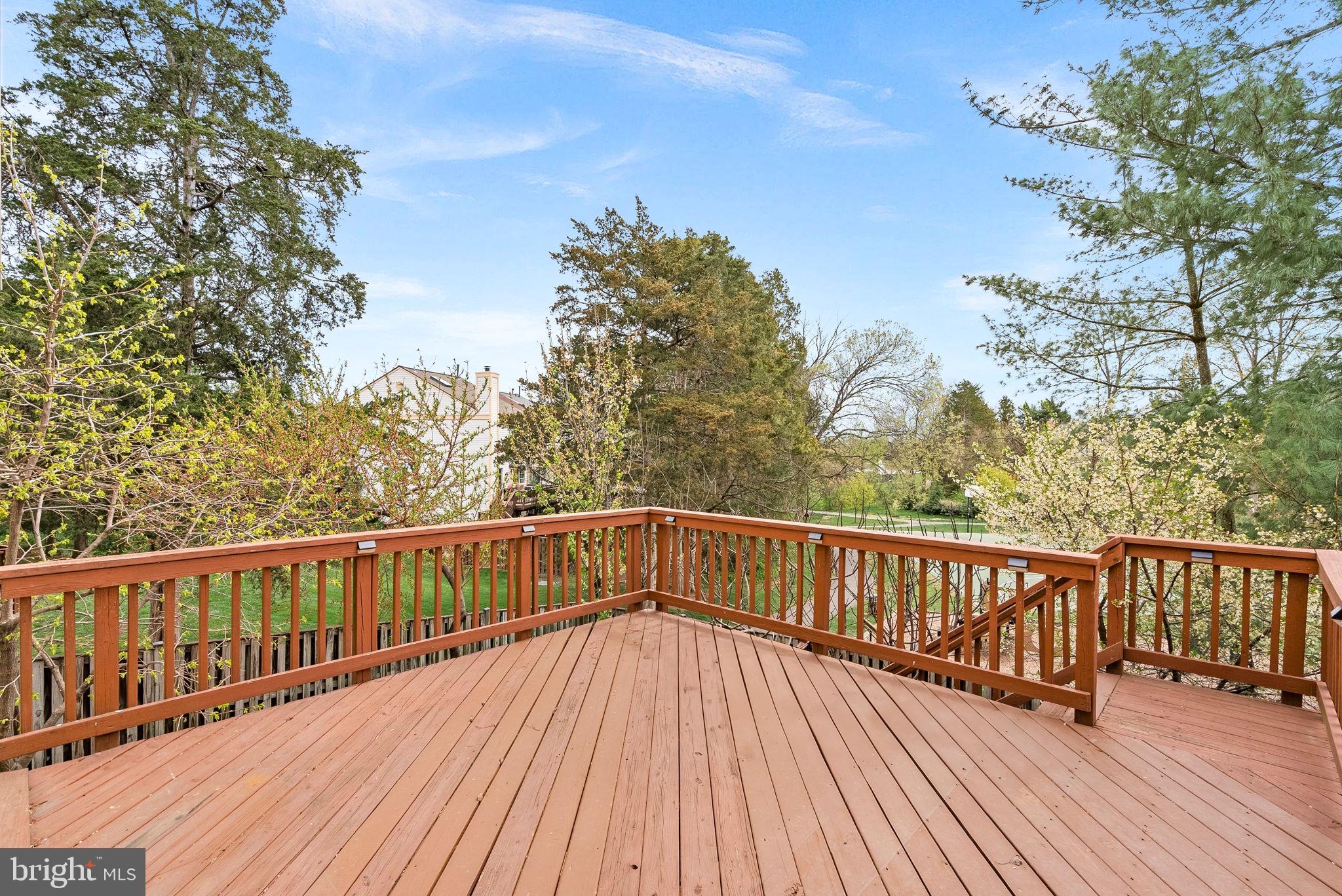 21074 Cornerpost Square Ashburn, VA 20147 - Photo 52 of 81 a view of balcony with wooden floor and fence