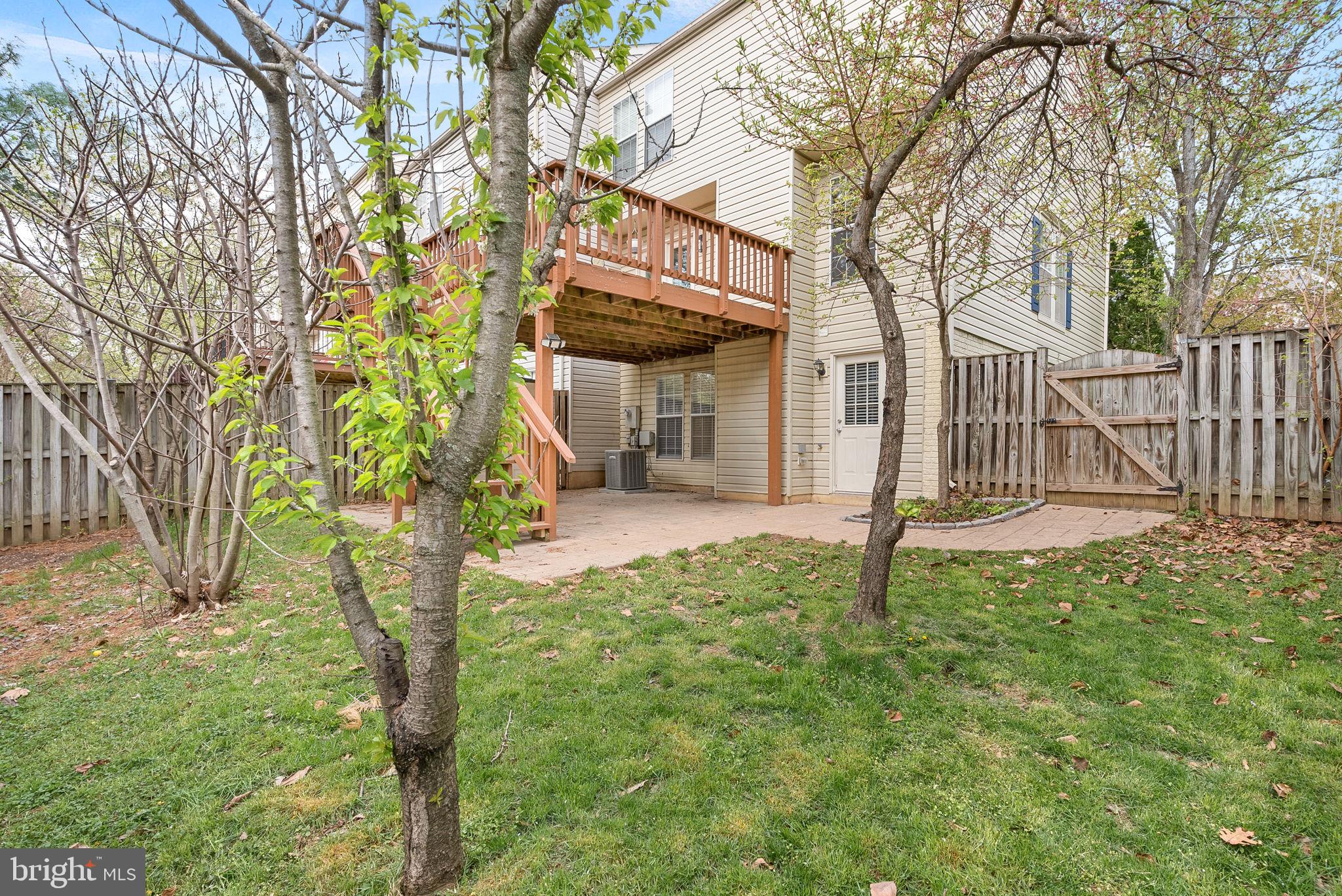 21074 Cornerpost Square Ashburn, VA 20147 - Photo 58 of 81 a front view of a house with a yard