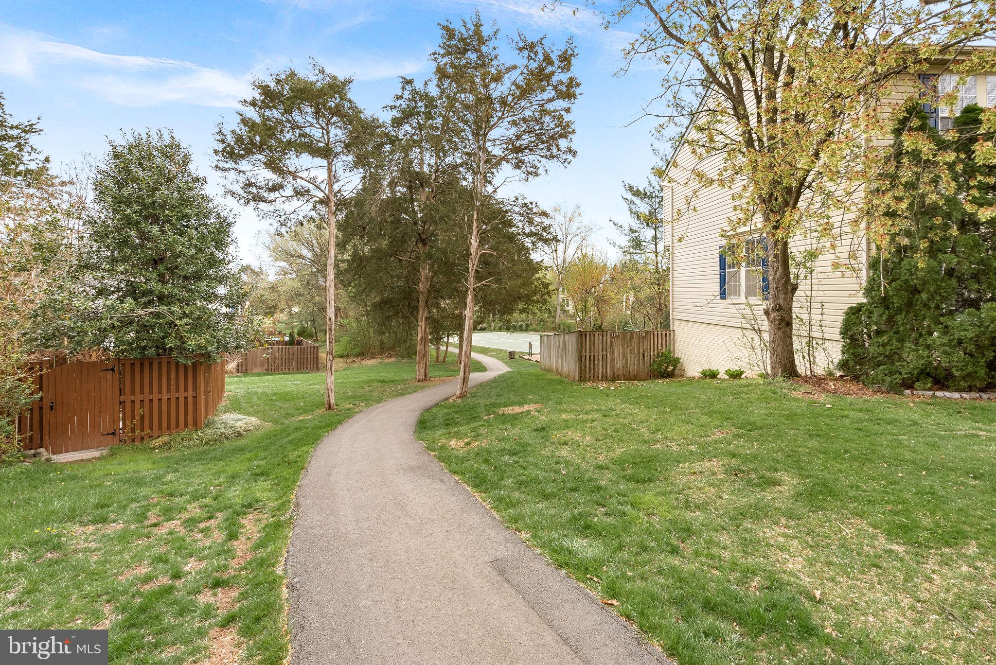 21074 Cornerpost Square Ashburn, VA 20147 - Photo 64 of 81 a view of a backyard with large trees