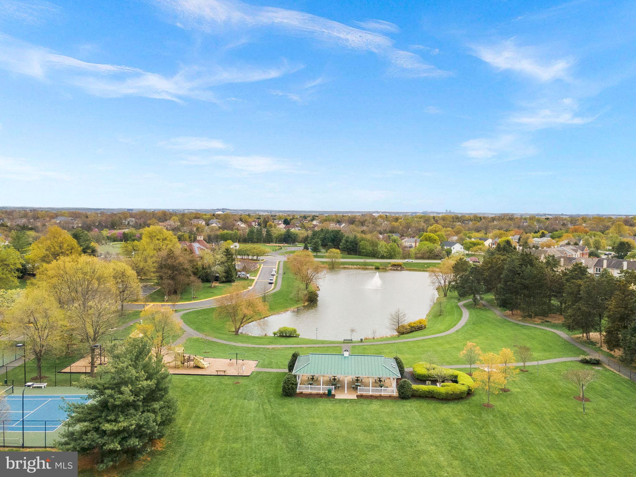 21074 Cornerpost Square Ashburn, VA 20147 - Photo 75 of 81 an aerial view of a house with a garden and lake view