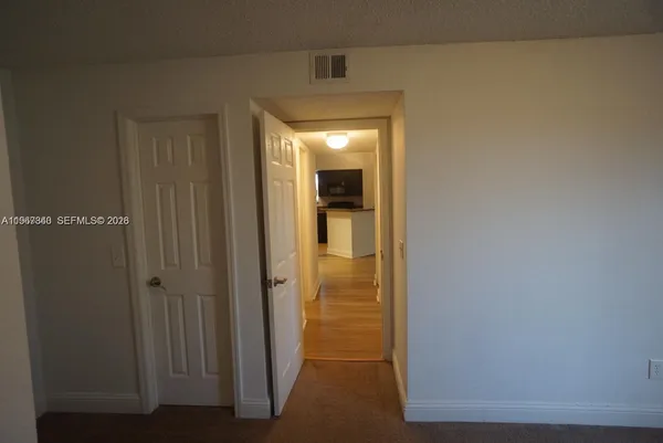 a view of a bathroom from a hallway