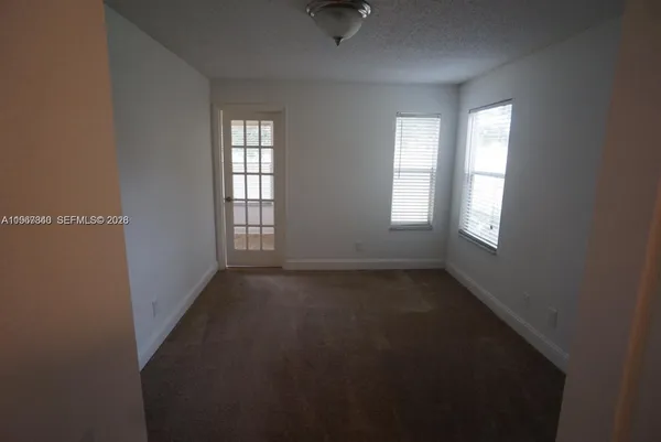 an empty room that has a window