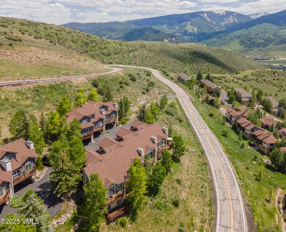 an aerial view of residential houses with outdoor space