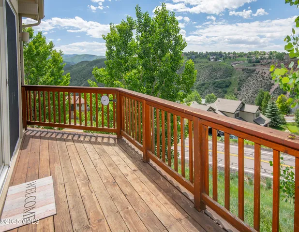 a view of balcony with wooden floor