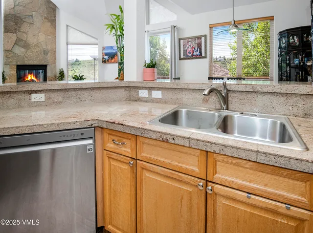a view of a hallway with wooden floor and entryway