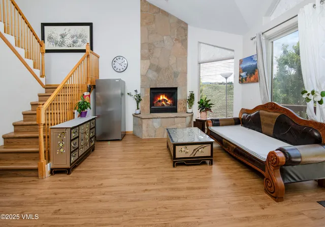 a living room with furniture and a fireplace