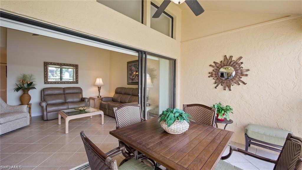 577 Beachwalk Circle, Unit R202 Naples, FL 34108 - Photo 16 of 44 View of patio featuring outdoor dining area