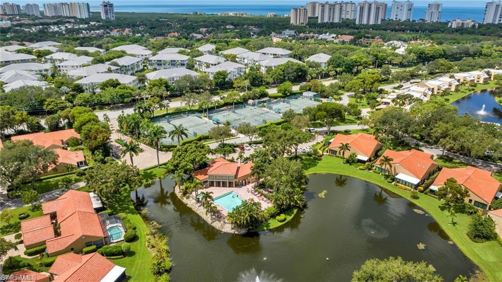 577 Beachwalk Circle, Unit R202 Naples, FL 34108 - Photo 30 of 44 View of urban area featuring a nearby body of water and nearby suburban area