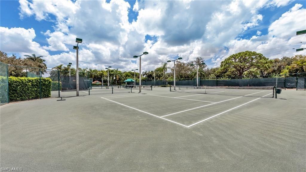 577 Beachwalk Circle, Unit R202 Naples, FL 34108 - Photo 33 of 44 View of tennis court
