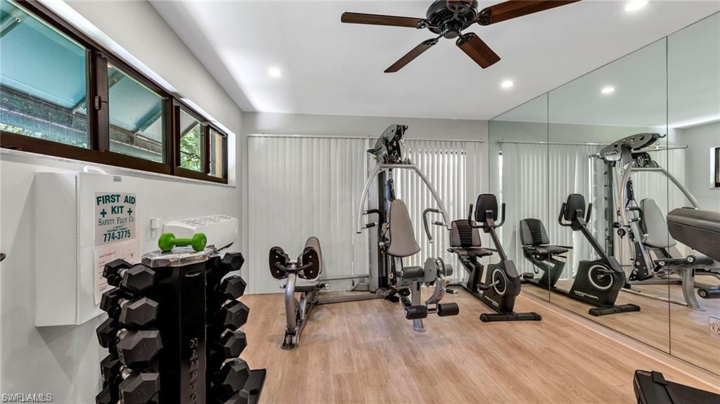 577 Beachwalk Circle, Unit R202 Naples, FL 34108 - Photo 34 of 44 Workout area featuring a ceiling fan and recessed lighting
