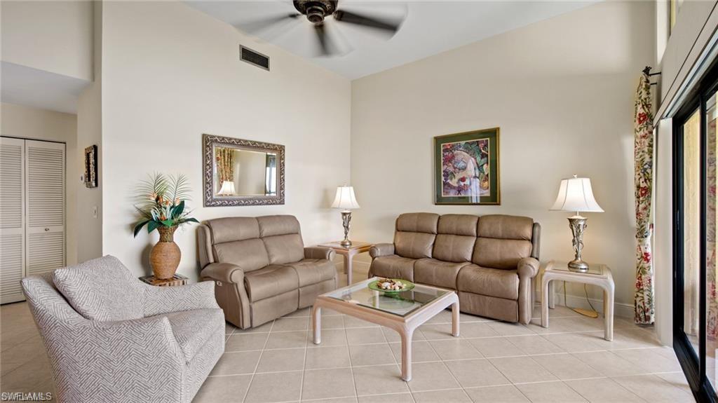 577 Beachwalk Circle, Unit R202 Naples, FL 34108 - Photo 7 of 44 Living room featuring ceiling fan and light tile patterned flooring