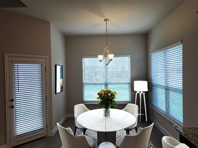 an empty room with windows and entrance