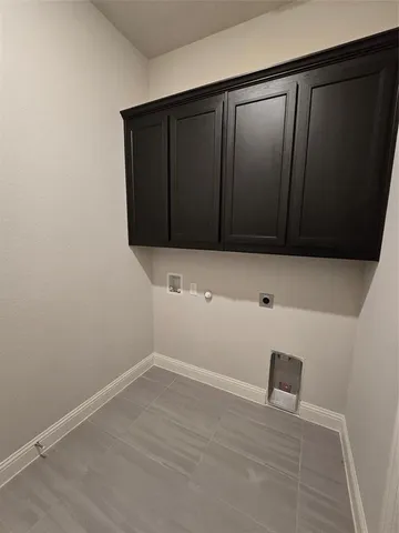 an empty room with a empty space and windows