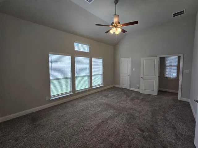 a bathroom with a double vanity sink a mirror and a bathtub