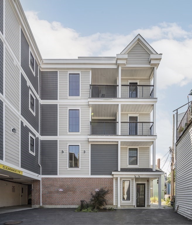9 R Trenton Street, Unit 1 Boston, MA 02128 - Photo 12 of 15 a large building with a lot of windows