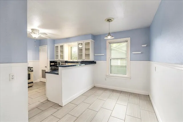 a view of kitchen and windows