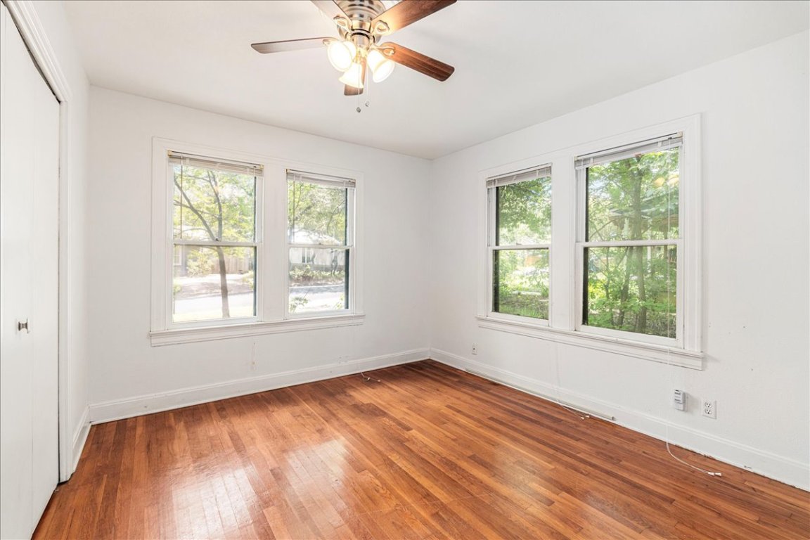 3710 Hollywood Avenue Austin, TX 78722 - Photo 22 of 39 a view of an empty room with wooden floor and a window