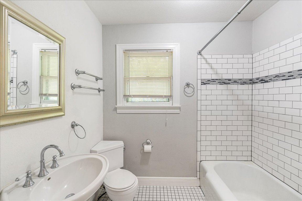 3710 Hollywood Avenue Austin, TX 78722 - Photo 24 of 39 a bathroom with a sink a toilet and shower