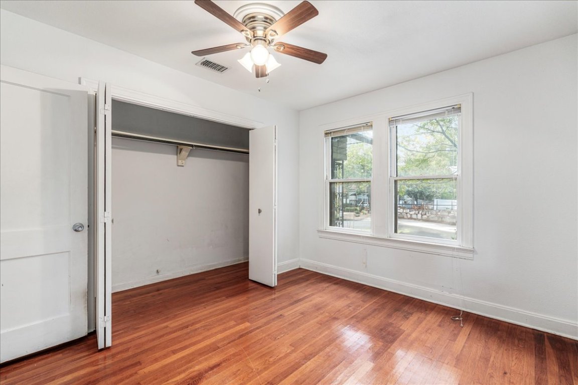 3710 Hollywood Avenue Austin, TX 78722 - Photo 29 of 39 a view of an empty room with wooden floor and a window