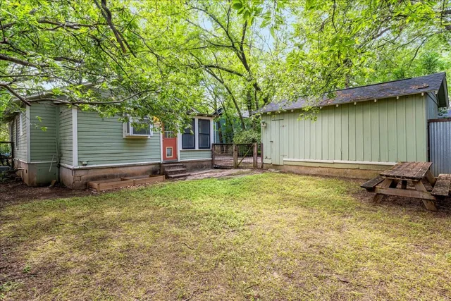 a backyard of a house with lots of green space