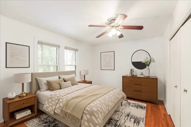 a bedroom with a bed and window