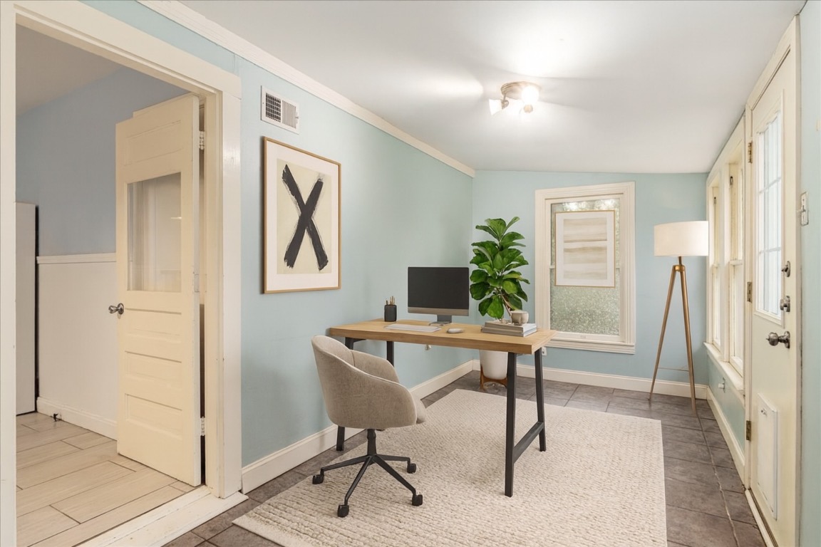 3710 Hollywood Avenue Austin, TX 78722 - Photo 8 of 39 a view of a workspace with furniture and a window