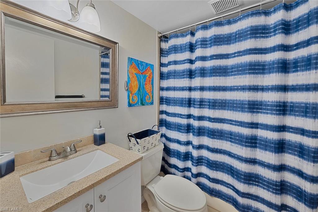 1981 Seminole Harbor Drive Alva, FL 33920 - Photo 16 of 19 a bathroom with a sink a toilet and mirror