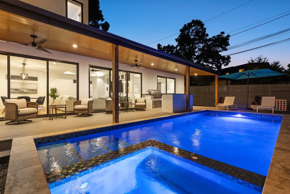 a view of a living room with furniture and kitchen view