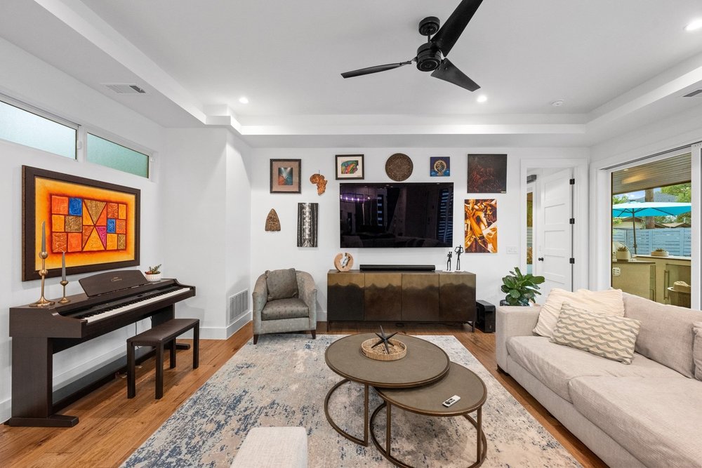 1003 Taffy Court Austin, TX 78704 - Photo 11 of 40 a living room with furniture and a flat screen tv