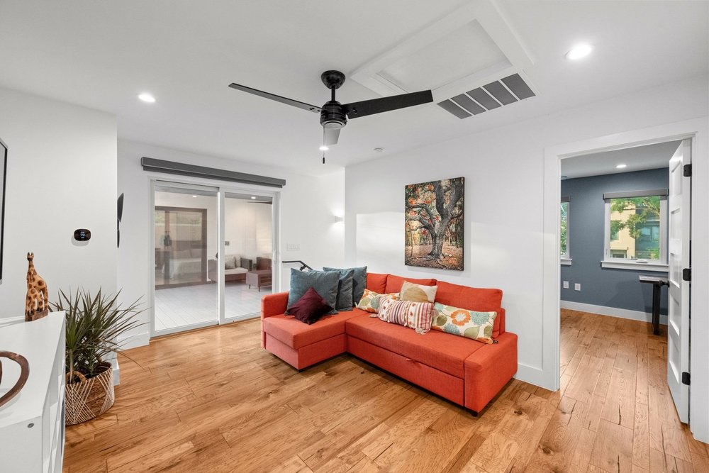 1003 Taffy Court Austin, TX 78704 - Photo 22 of 40 a living room with furniture and a wooden floor