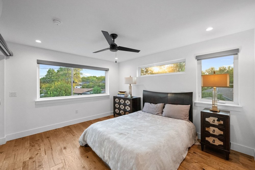 1003 Taffy Court Austin, TX 78704 - Photo 31 of 40 a bedroom with a large bed and a window