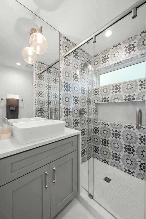 1003 Taffy Court Austin, TX 78704 - Photo 32 of 40 a bathroom with a sink and a mirror