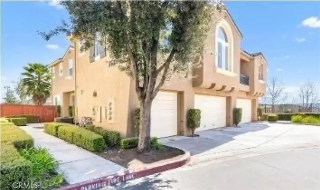 a view of a street with houses on both side