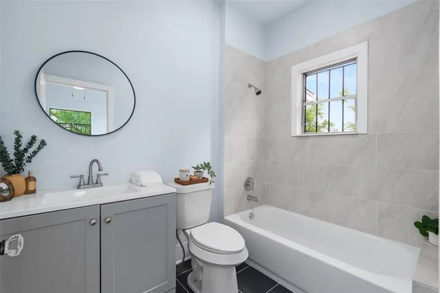 a bathroom with a toilet a sink and a bathtub