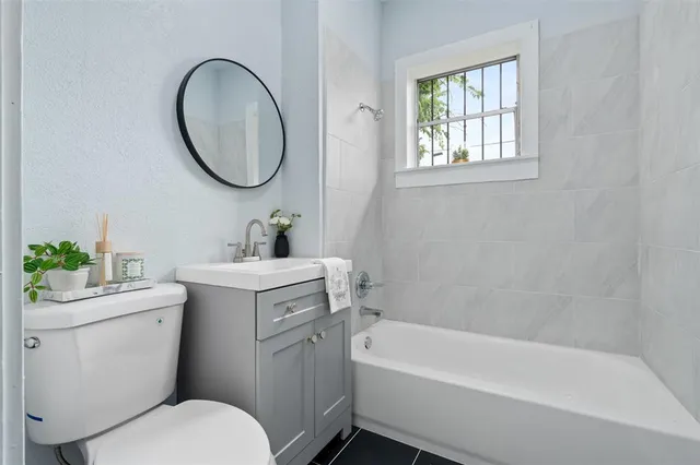 a bathroom with a sink toilet and a bathtub