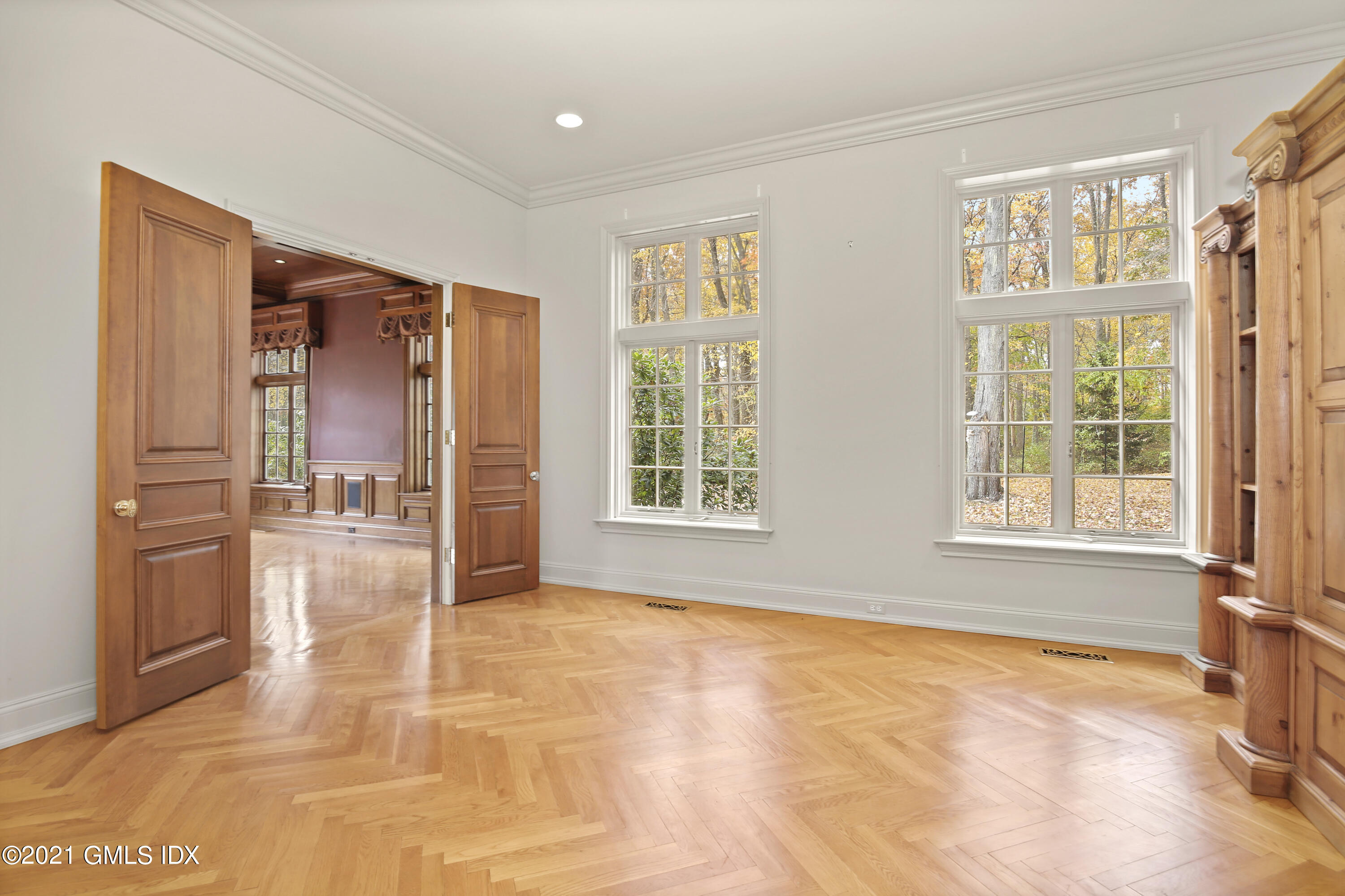 18 Lower Cross Road Greenwich, CT 06831 - Photo 12 of 40 a view of an empty room with a fireplace and a window
