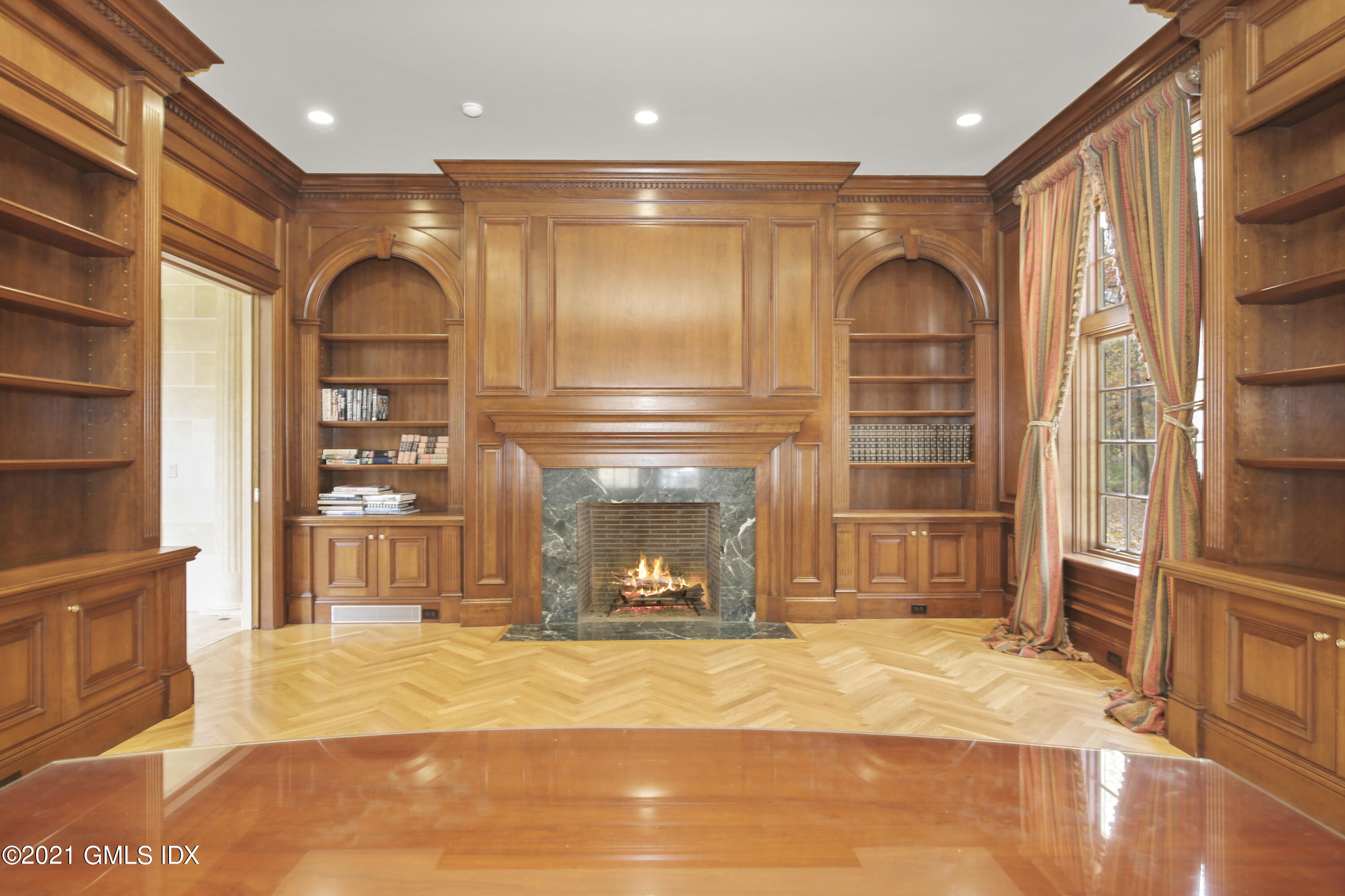 18 Lower Cross Road Greenwich, CT 06831 - Photo 13 of 40 a room with wooden floor and a fireplace