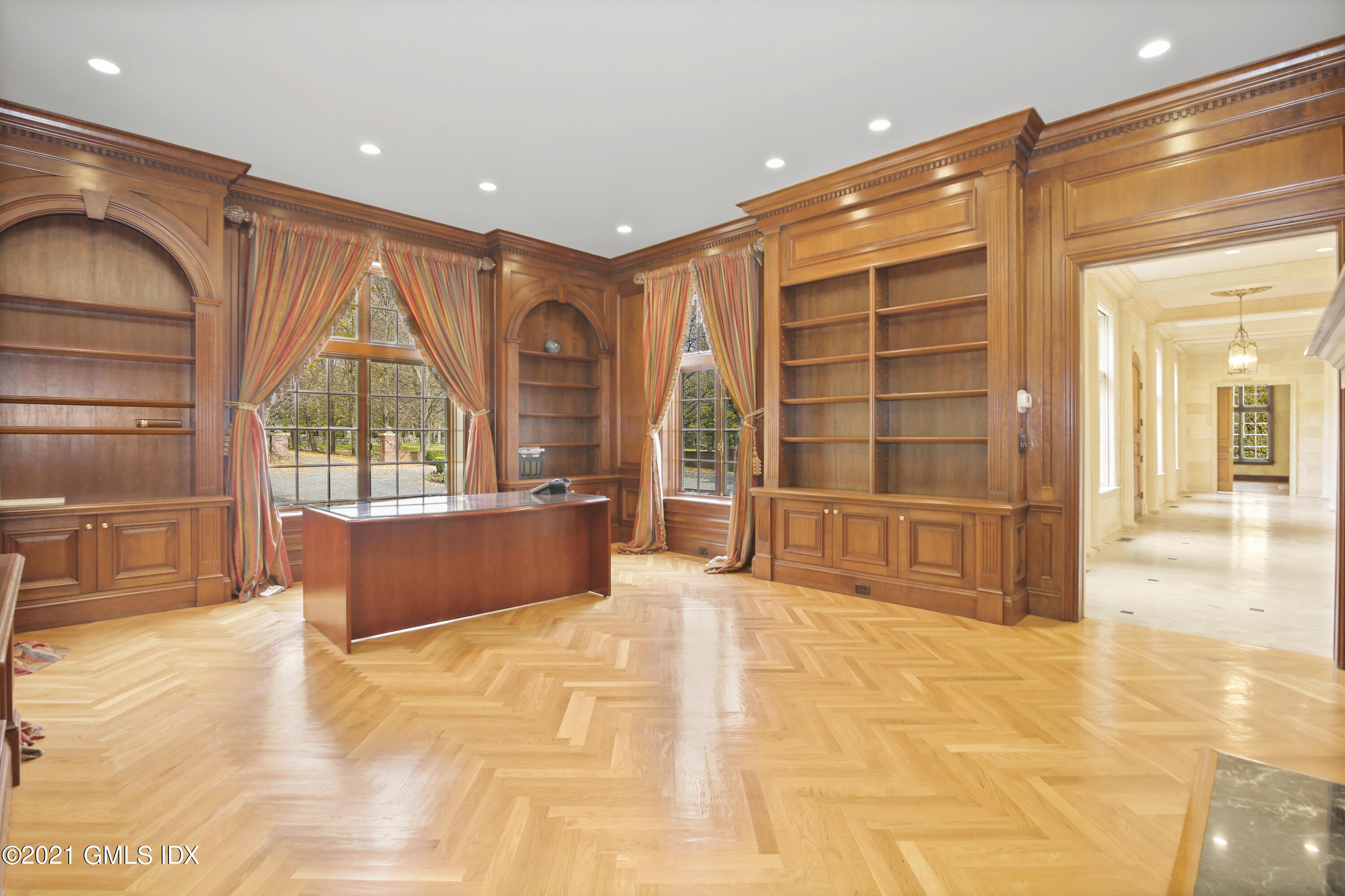 18 Lower Cross Road Greenwich, CT 06831 - Photo 14 of 40 a spacious bedroom with a large bed and a large window