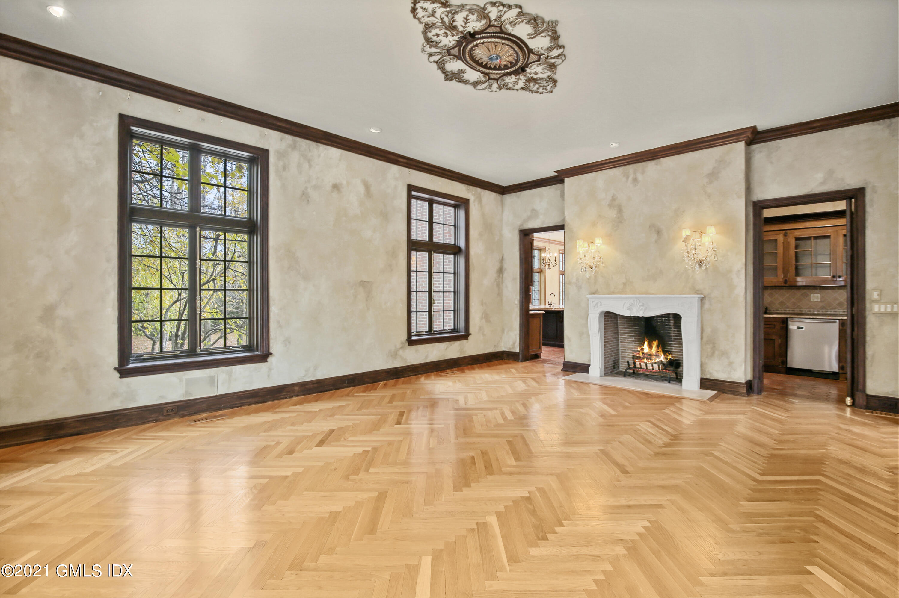 18 Lower Cross Road Greenwich, CT 06831 - Photo 16 of 40 a view of an empty room with a fireplace and a window