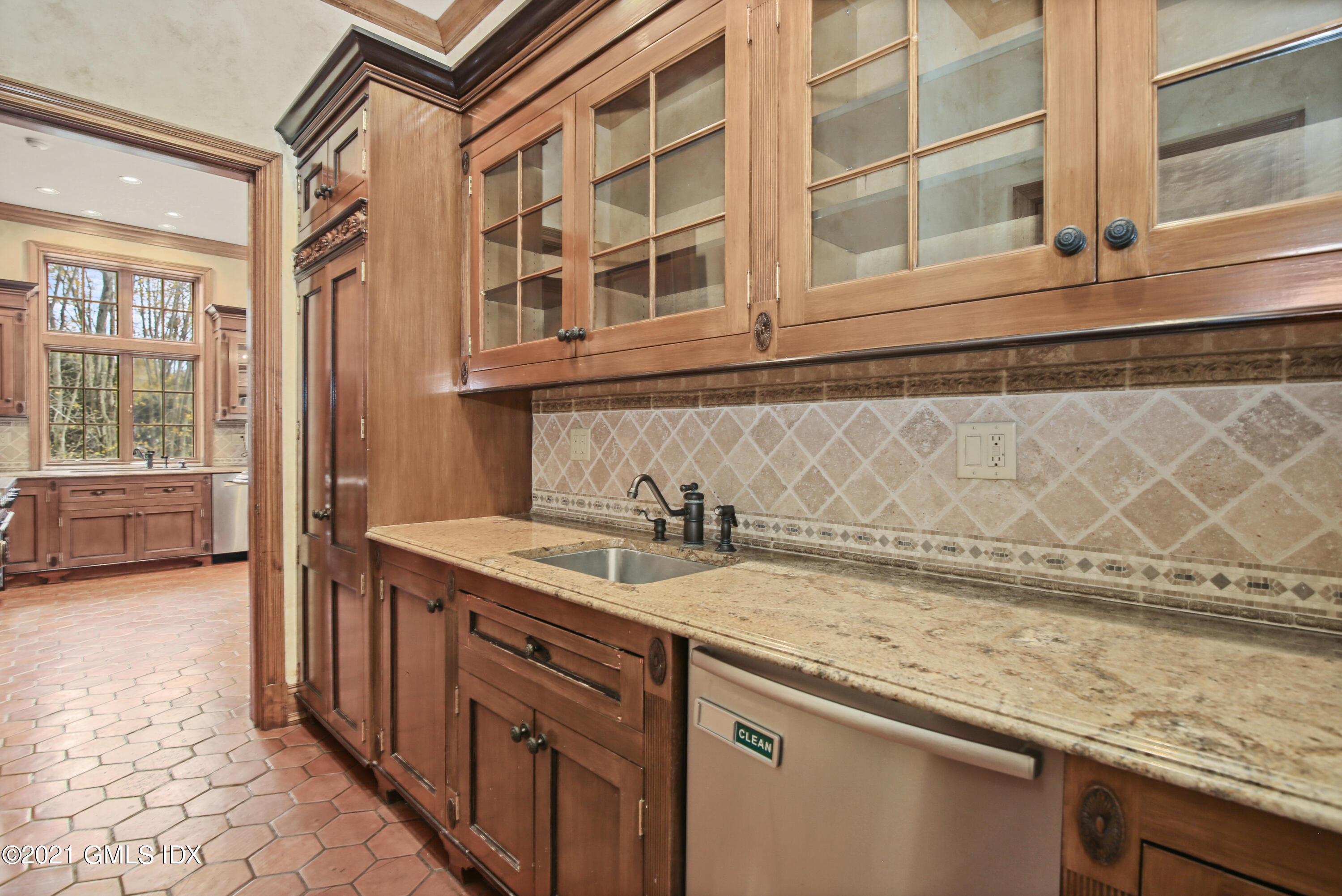 18 Lower Cross Road Greenwich, CT 06831 - Photo 17 of 40 a view of a kitchen and a sink dishwasher a stove next to a window