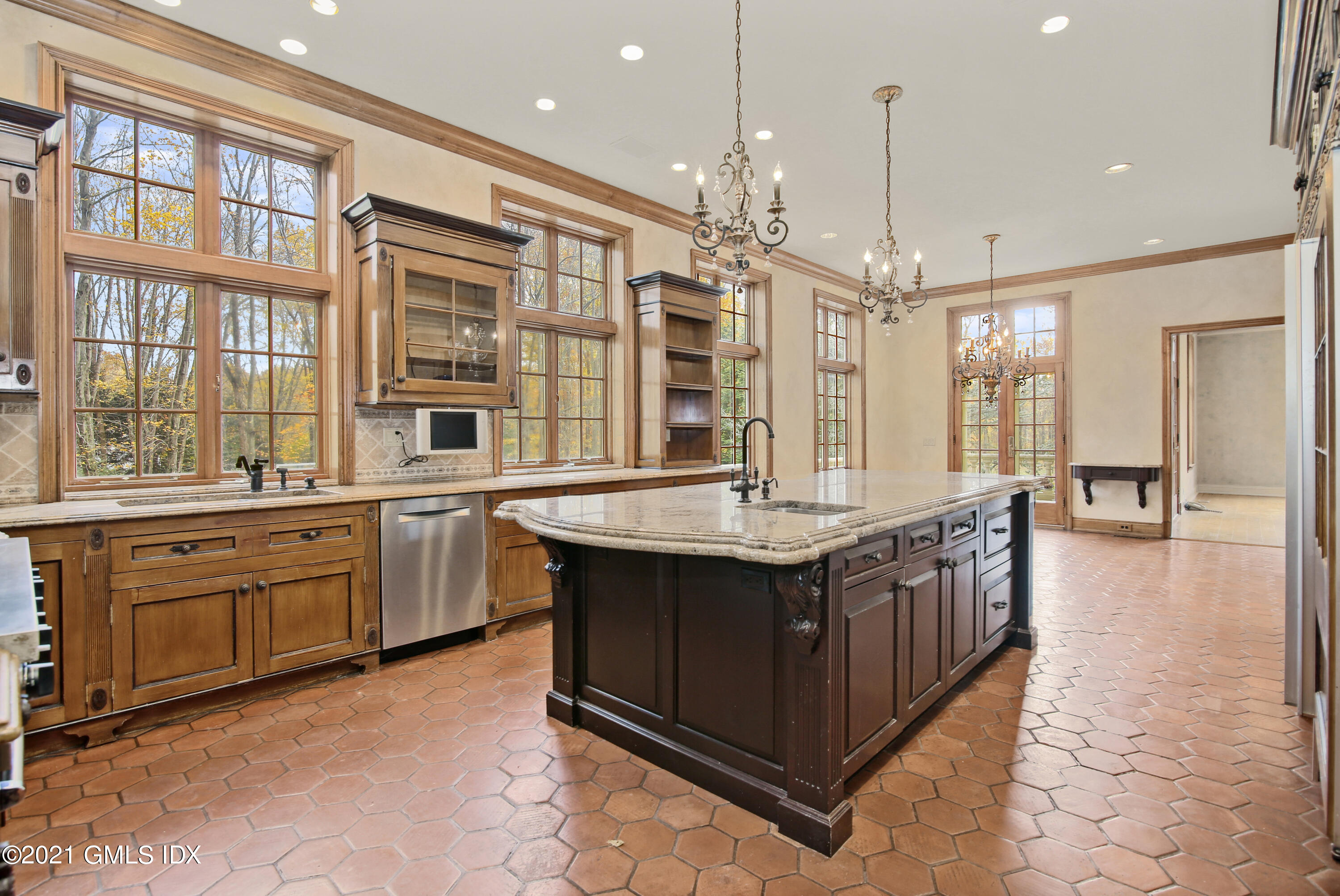 18 Lower Cross Road Greenwich, CT 06831 - Photo 18 of 40 a large kitchen with stainless steel appliances granite countertop a stove and a sink